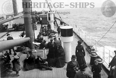 Steerage passengers gathered on the foredeck of the Cunard Line steamship Saxonia (1). The image is from a snapshot taken by a passenger on a voyage from Boston to Liverpool in June 1905 (arrived Liverpool June 2)