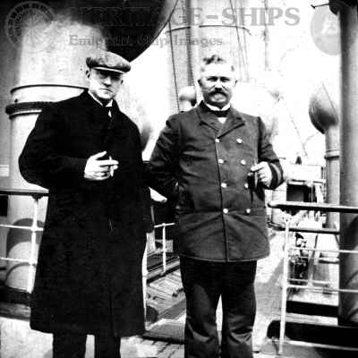 Captian Otto Cuppers posing with a passenger on the deck of the steamer on a voyage in April 1904.