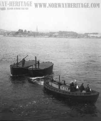 Barges being towed to the S/S United States outside Kristiansand on a voyage in July 1913
