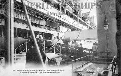 Norddeutscher Lloyd steamship built 1902 at Stettin by AG Vulcan. On this old postcard the ship is seen when calling at Cherbourg, France. The tender Lloyd is alongside to embark and disembark passengers and bagage.