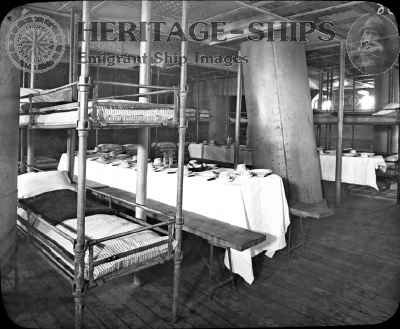 Third-class (steerage) accommodations aboard the Cunard Line steamships Lucania and Campania. Passengers slept and ate in the same saloon, an arrangement that could present considerable challenges in rough weather.
